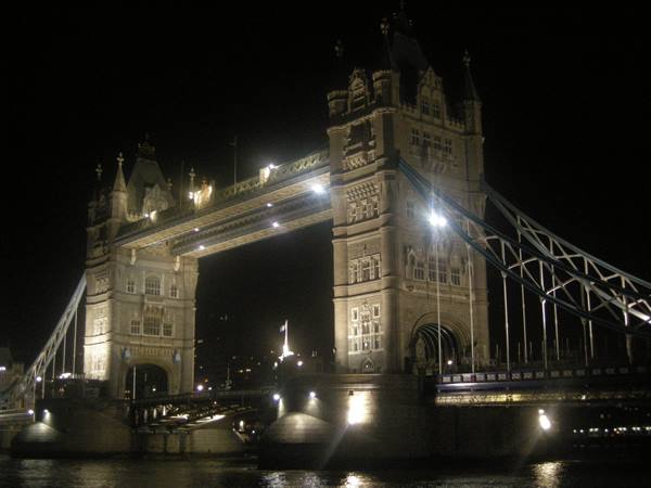 Illuminated Tower Bridge at night over the Thames in London