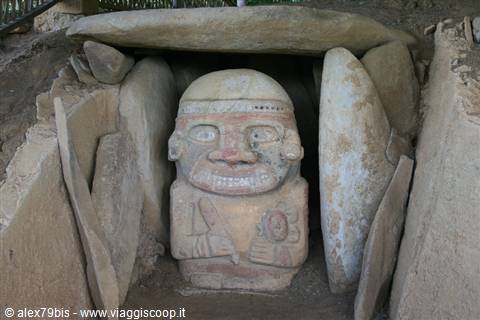 Painted stone statue of San Agustín inside a megalithic tomb