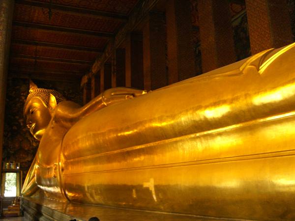 Golden reclining Buddha statue inside Wat Pho temple