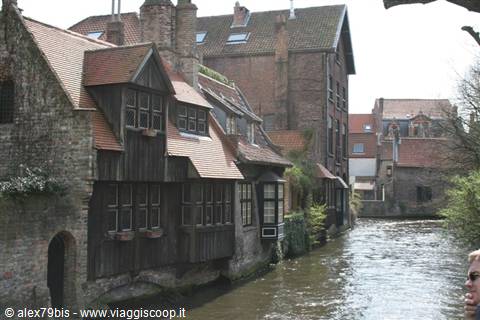 Medieval brick and wooden houses along a canal in Bruges