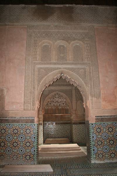 Saadian Tombs in Marrakech: carved plaster arch and colorful zellige tilework