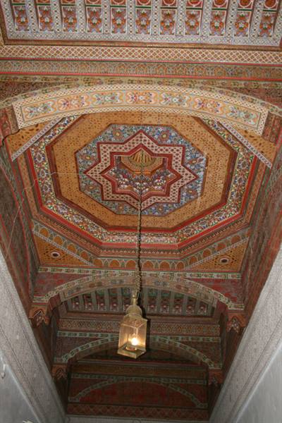 Painted wooden ceiling with octagonal medallion and hanging lantern