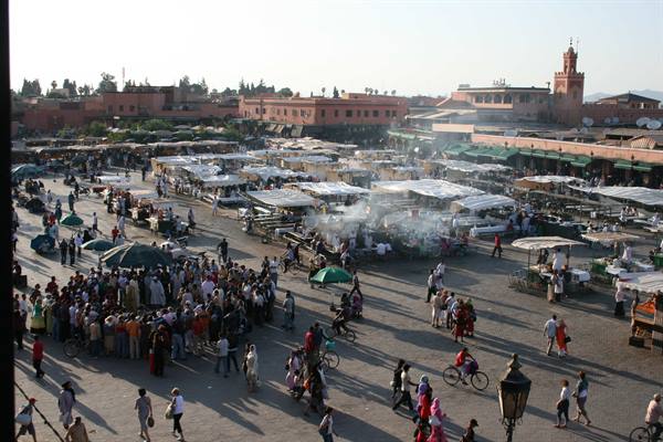 Crowds and smoking food stalls on Jemaa el-Fna square in Marrakech