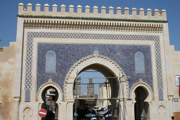 Bab Bou Jeloud gate in Fez, blue zellige tiles and scaffolding in front
