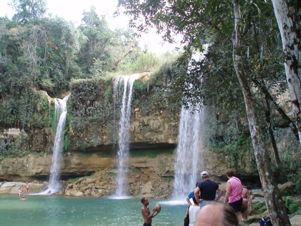 Tourists by the green pool at Agua Azul waterfalls