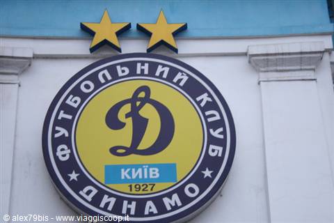 Dynamo Kyiv club crest with two golden stars on white facade
