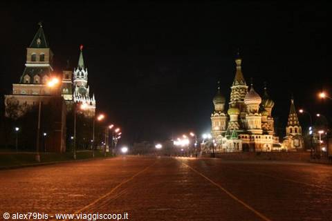 Red Square at night: Kremlin towers and St Basil's colorful domes illuminated