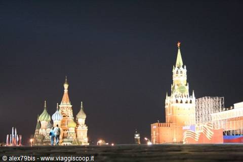 Red Square at night: the illuminated Kremlin tower and St Basil's Cathedral