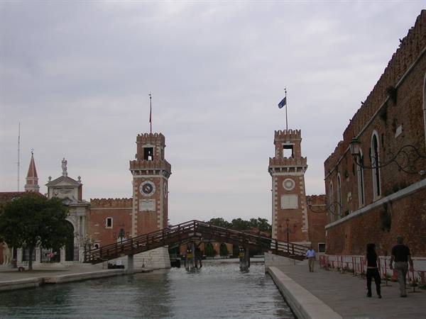 Venice Arsenal: brick clock towers, wooden bridge over the canal