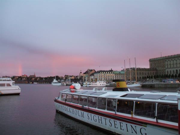 Stockholm sightseeing boat moored beside the royal palace