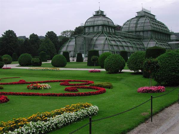The Palmenhaus at Schönbrunn, glass and iron greenhouse among flowerbeds