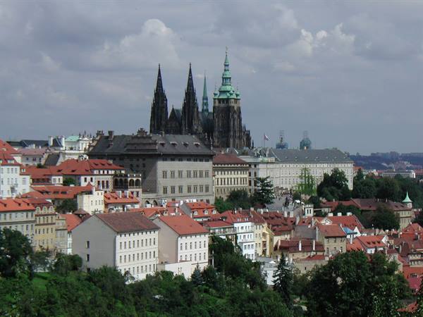 Prague Castle with St Vitus Cathedral above the red rooftops
