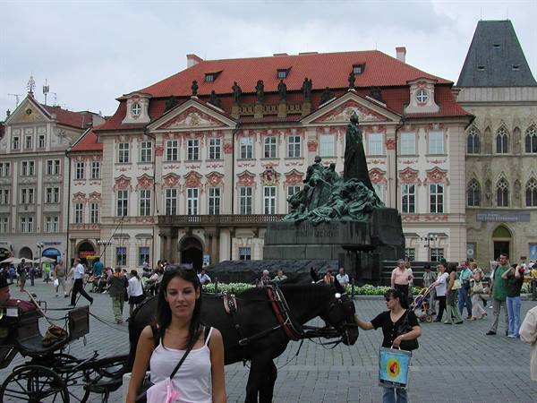 Girl next to a horse in front of the Jan Hus monument, Old Town Square, Prague