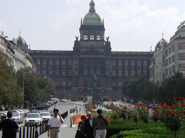 Tourists walk toward the National Museum on Wenceslas Square, Prague