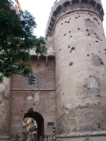 Medieval round tower scarred by cannonballs, Torres de Quart in Valencia