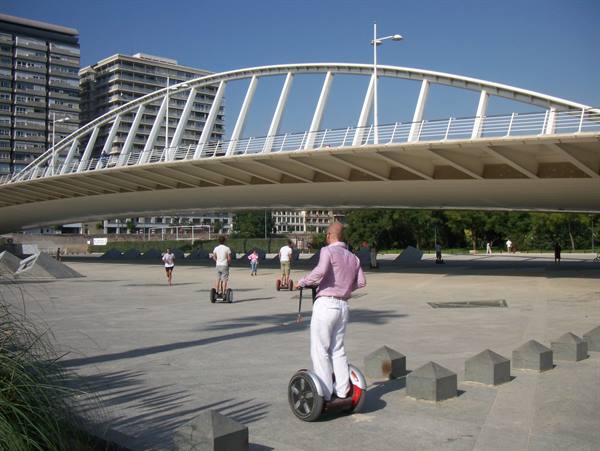 Segway tourists ride beneath Calatrava's white steel bridge in Barcelona