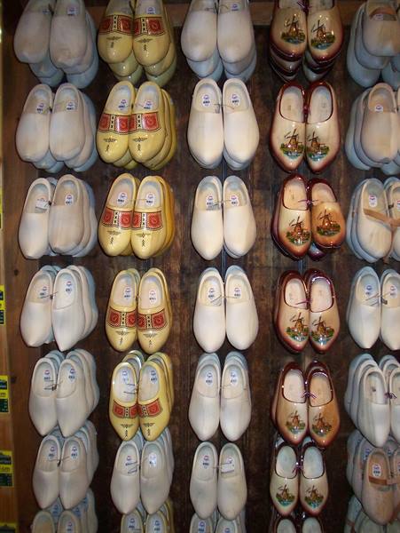 Painted wooden clogs hanging on a Dutch shop wall