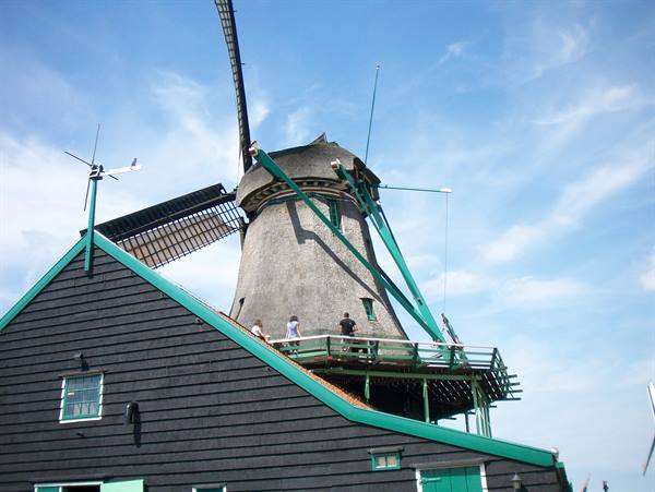 Tourists on wooden walkway around a windmill, Zaanse Schans