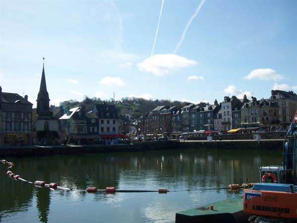 Honfleur old harbour with wooden church spire and quayside houses
