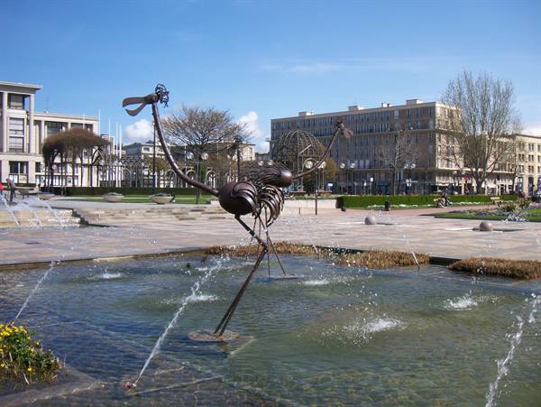 Metal insect sculpture standing in a fountain, Le Havre