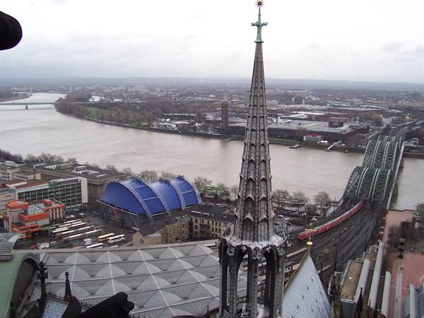 Gothic spire of Cologne Cathedral over the Rhine with Hohenzollern Bridge
