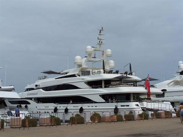 The superyacht Lionheart moored at the marina, grey sky, fenced quay