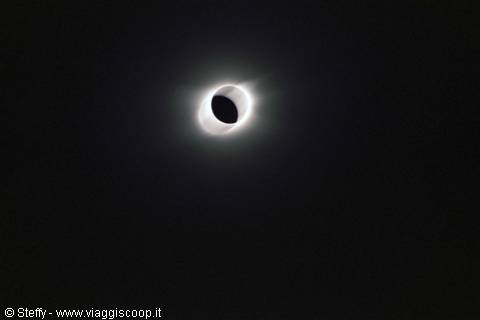 Total solar eclipse: white corona surrounding the Moon's black disk