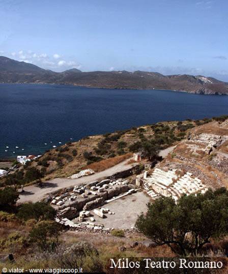 Ruins of the Roman theatre of Milos above the bay with boats