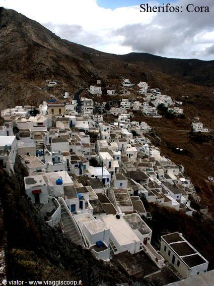 Whitewashed cubic houses of Chora clinging to Serifos barren hillside