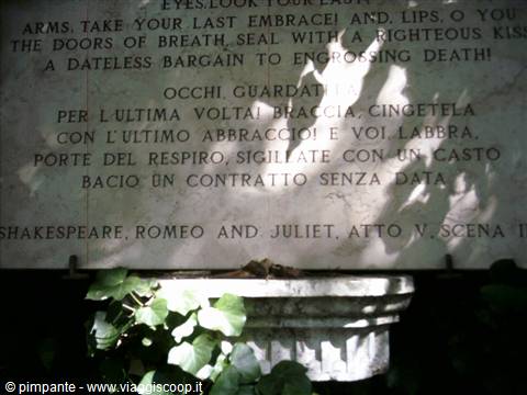 Marble plaque quoting Romeo and Juliet in English and Italian, leaf shadows
