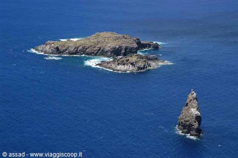 Rock stack of Pan di Zucchero and islet in deep blue sea