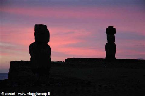 Moai silhouettes against a pink twilight sky, Easter Island