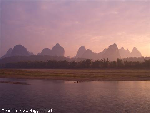 Pink dawn over karst peaks along the Li River, Guangxi
