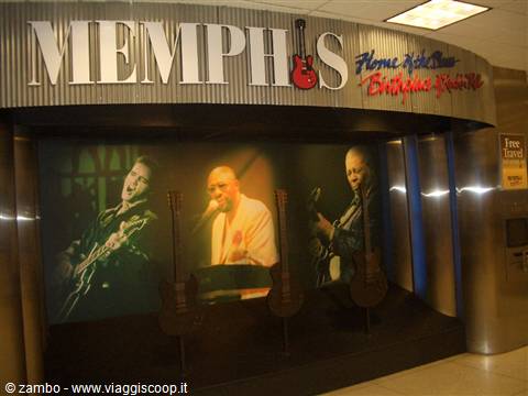 Memphis sign with red guitar and musician mural, indoor lighting