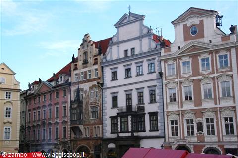 Historic colorful buildings with baroque decorated facades in Prague's Old Town Square