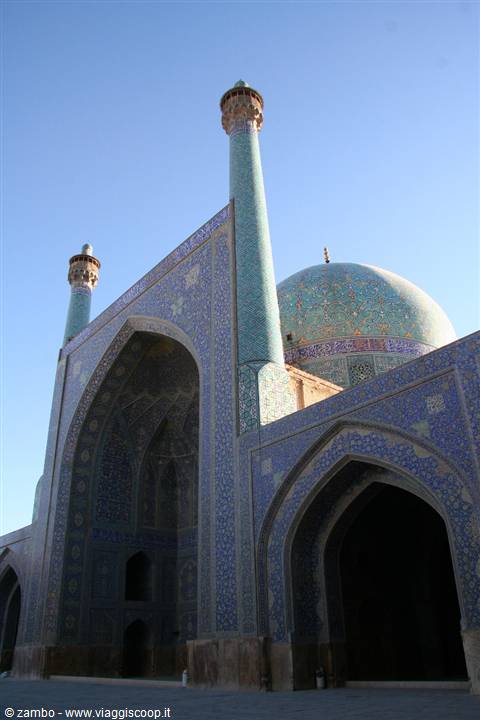 Shah Mosque in Esfahan, turquoise tiles and minaret under blue sky