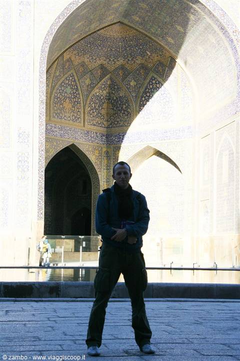 Traveler beneath the tiled iwan of the Shah Mosque, Esfahan