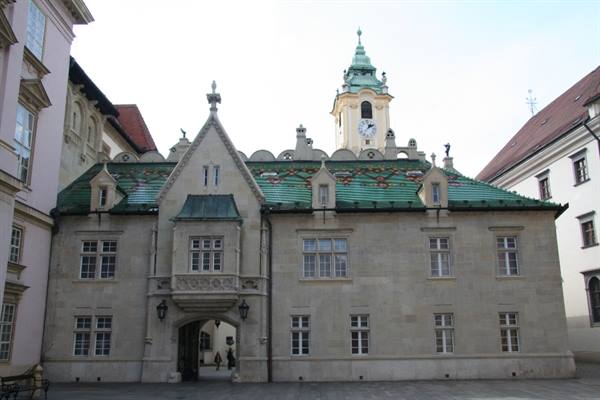 Bratislava Old Town Hall, stone facade with green tiled roof and clock tower