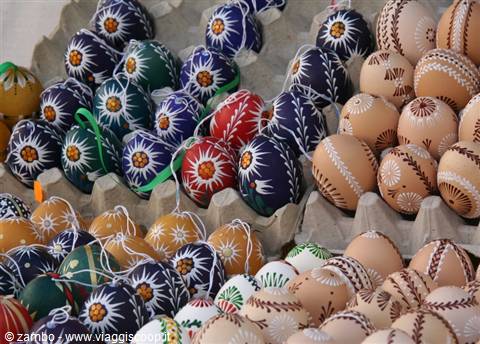 Hand-painted Easter eggs with floral patterns at a market