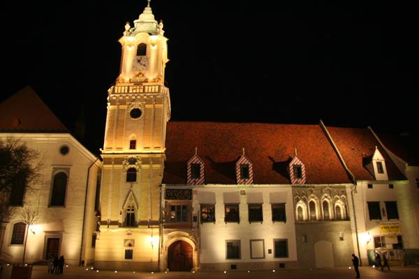 Bratislava Old Town Hall lit up at night with its tower