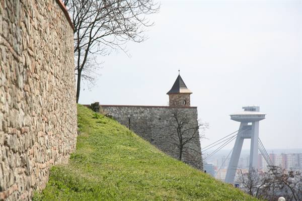 Stone walls of Bratislava Castle, small tower and UFO bridge tower