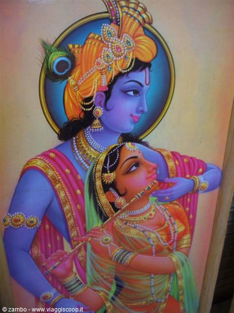 Painting of blue Krishna with flute and Radha, vivid colors