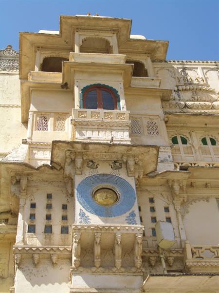 Udaipur City Palace facade, blue solar mural on pale stone