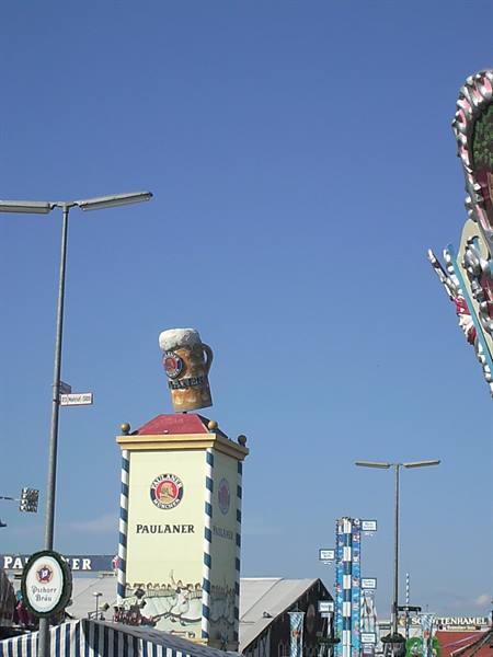 Paulaner advertising tower with giant beer mug at Munich Oktoberfest