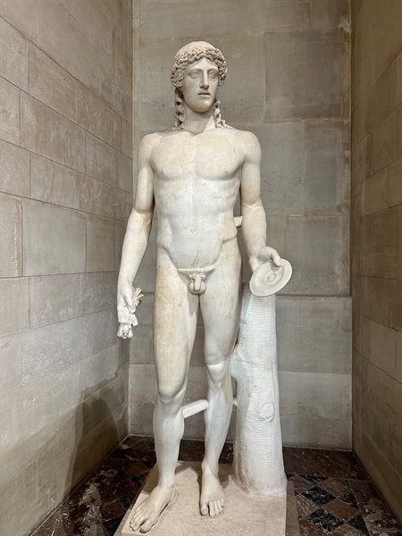 In front of the Louvre's Adonis, a moment of silence and wonder.