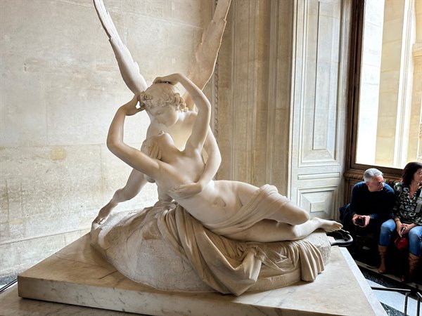 In front of Psyche Awakened by Cupid's Kiss by Canova, amazed at the Louvre.