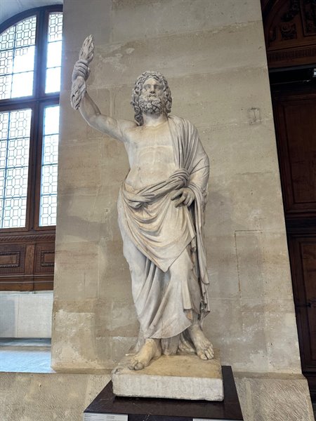 Standing enchanted before this statue at the Louvre.