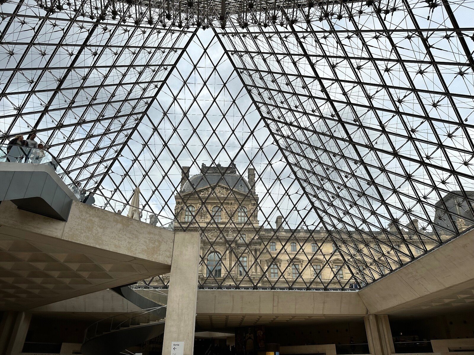 Under the Louvre's glass pyramid, time seems suspended.