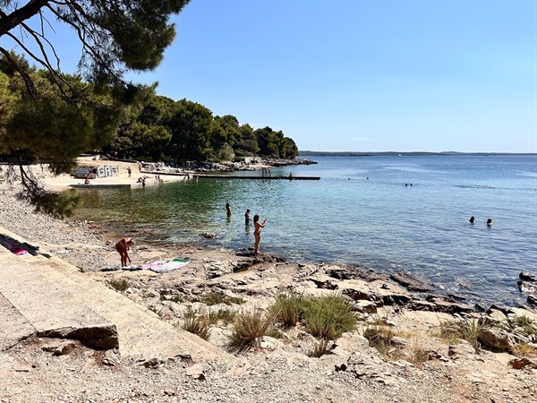 A dip in the crystal-clear waters of an Adriatic cove, a perfect day.