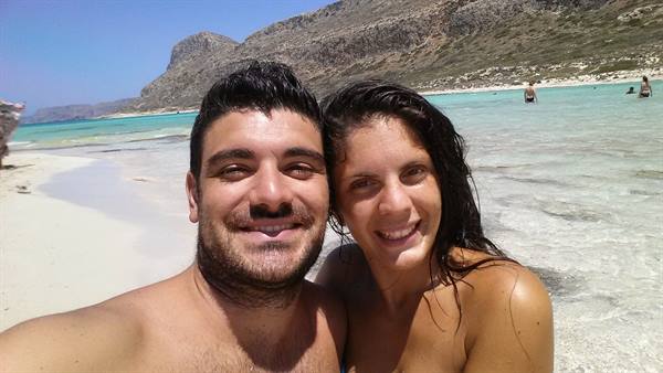 She smiles happily after a dip in the turquoise waters of Balos, Crete.